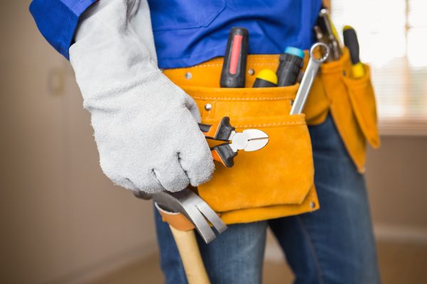 close-up-of-handyman-in-tool-belt-in-a-new-house-2023-11-27-05-20-20-utc-min